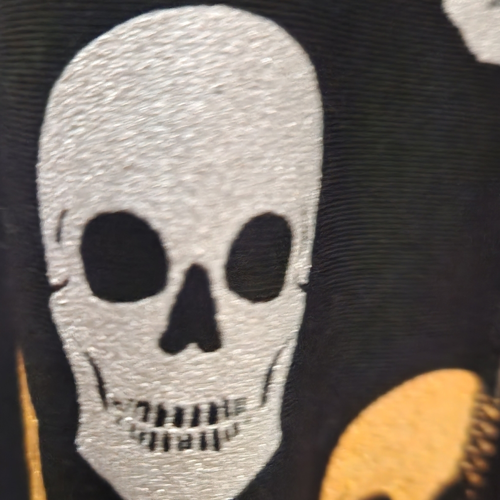 Torrid, black high-rise silver/gold glitterskull leggings with pockets